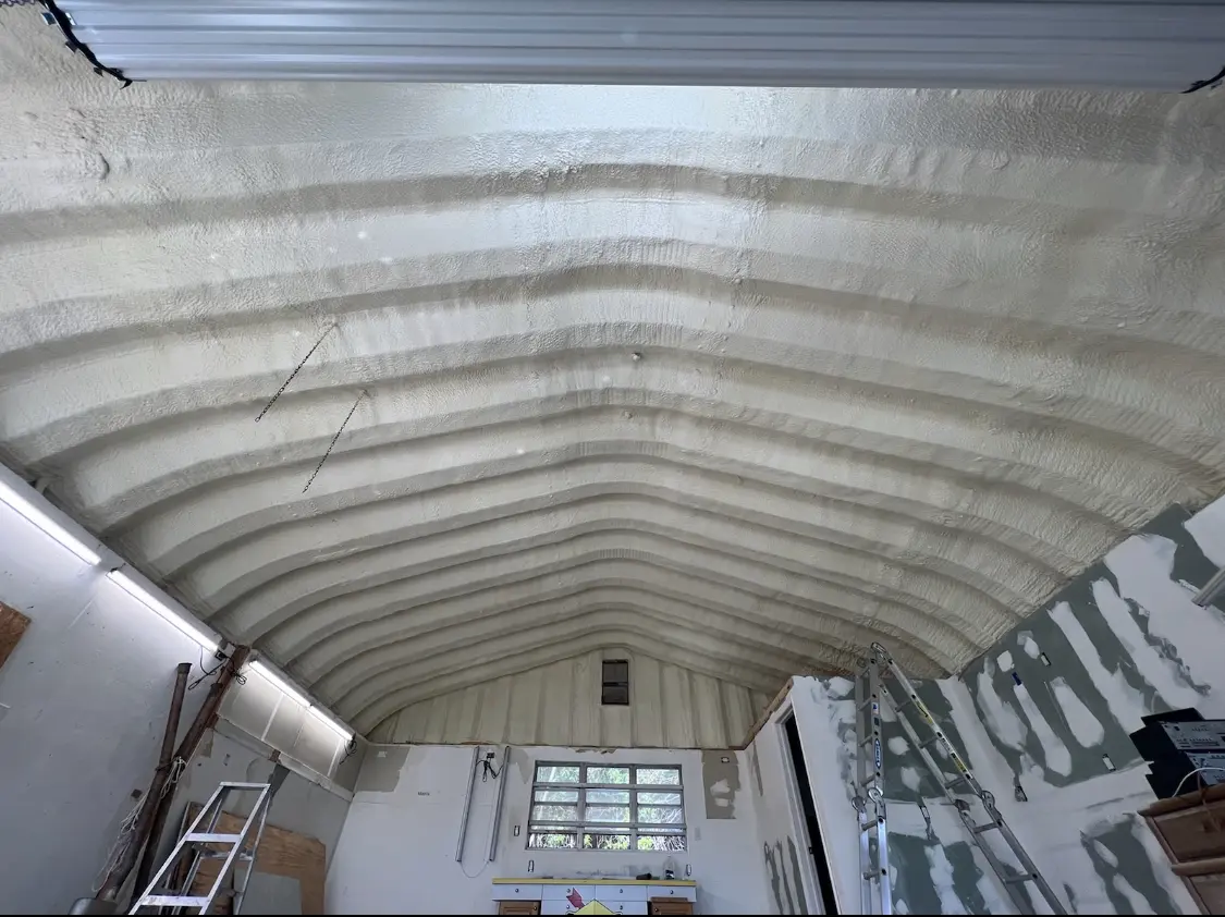 Spray polyurethane foam applied to the underside of a metal roof deck in University of Virginia